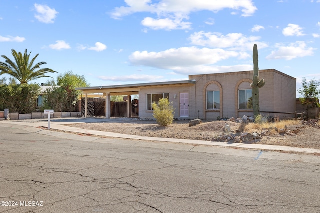 view of front facade with a carport