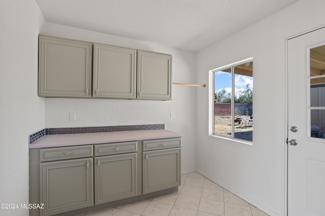 kitchen with gray cabinetry