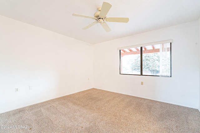 unfurnished room featuring carpet and ceiling fan