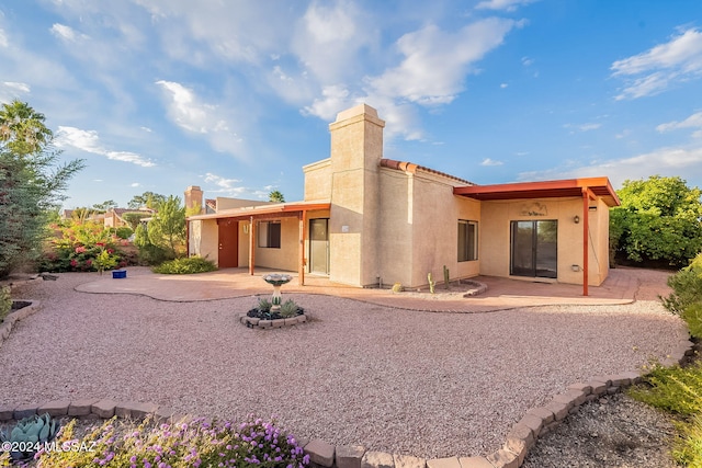 rear view of house with a patio