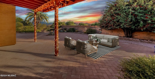 patio terrace at dusk with an outdoor living space