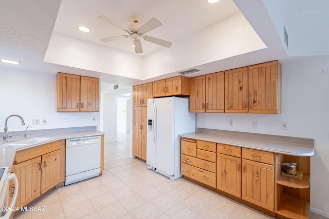 kitchen with white appliances, ceiling fan, and sink