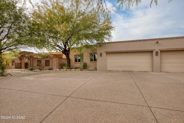 southwest-style home featuring a garage