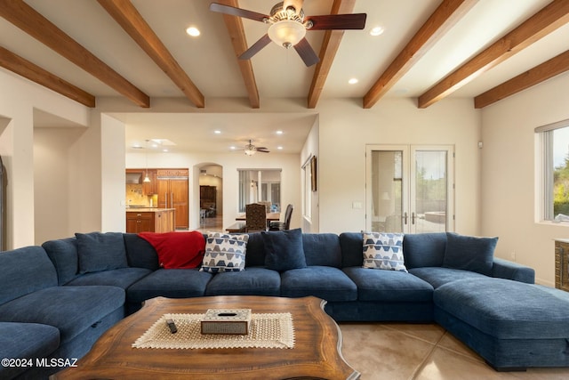 living room with beam ceiling and ceiling fan