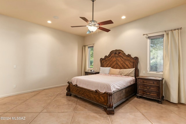 tiled bedroom with ceiling fan