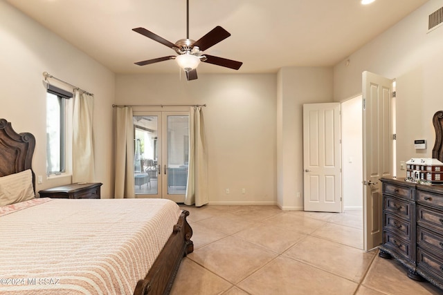 tiled bedroom with access to exterior, french doors, and ceiling fan