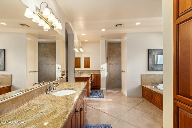 bathroom with tile patterned floors, vanity, and plus walk in shower