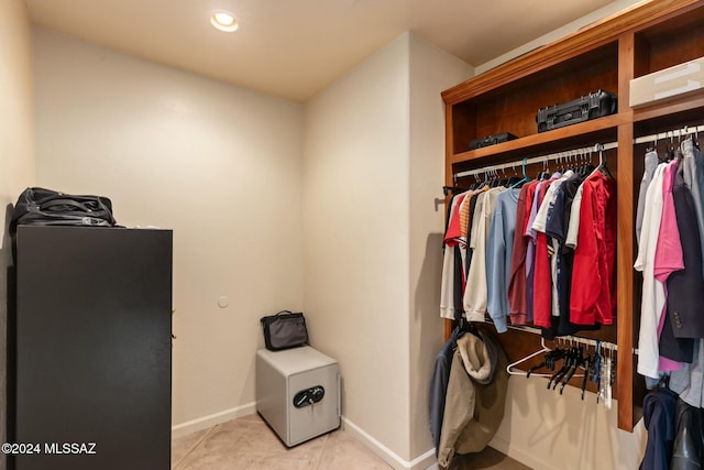 walk in closet featuring light tile patterned floors