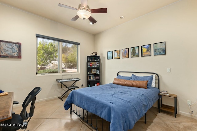 tiled bedroom with ceiling fan