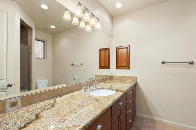 bathroom with vanity and toilet