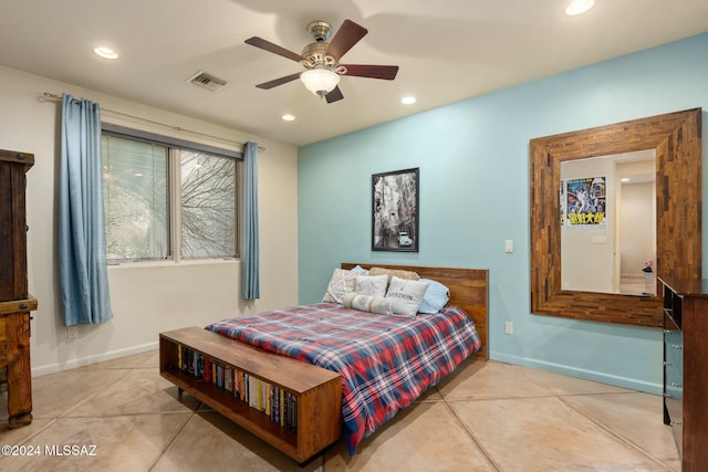 tiled bedroom featuring ceiling fan