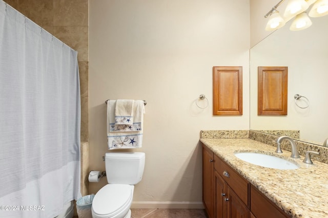 bathroom with tile patterned floors, walk in shower, vanity, and toilet