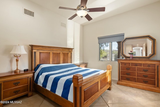 bedroom with ceiling fan and light tile patterned flooring