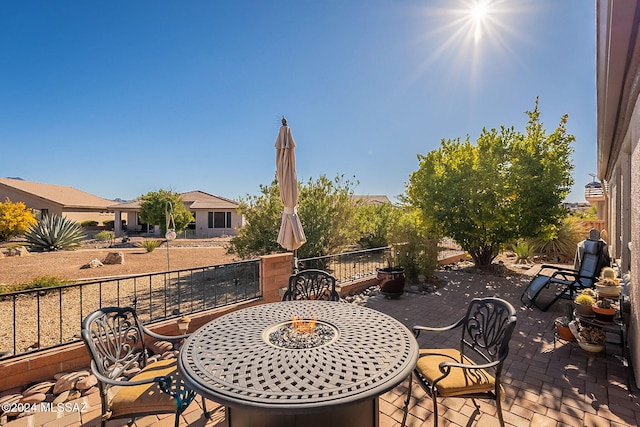 view of patio / terrace with an outdoor fire pit