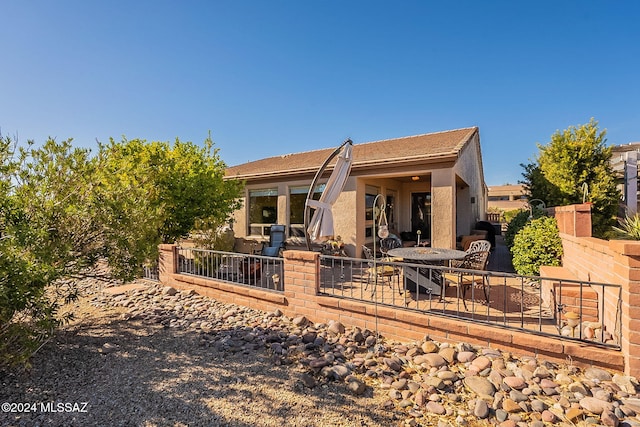 rear view of property with a patio