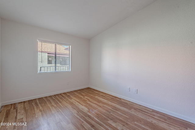 unfurnished room with light wood-type flooring