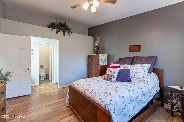 bedroom with ceiling fan, light hardwood / wood-style floors, and connected bathroom