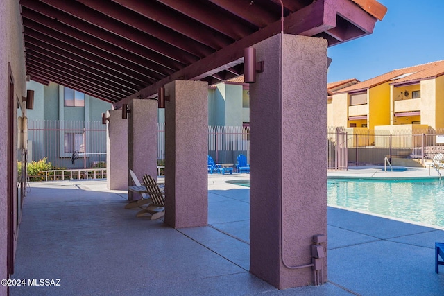 view of patio with a community pool