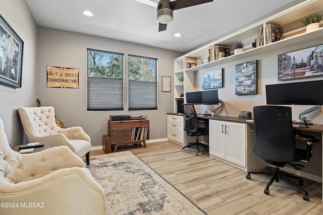 office with ceiling fan and light wood-type flooring