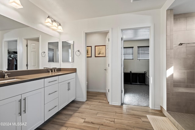 bathroom with wood-type flooring and vanity