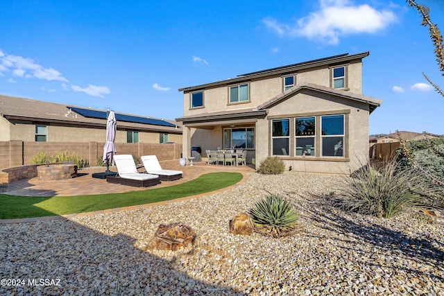 back of house featuring a patio