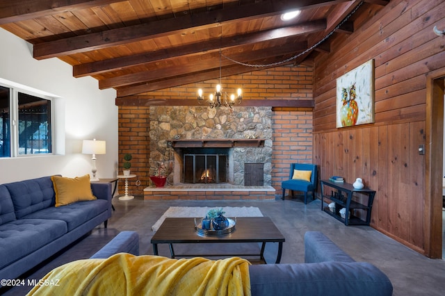 living room with an inviting chandelier, wood ceiling, wood walls, a fireplace, and vaulted ceiling with beams