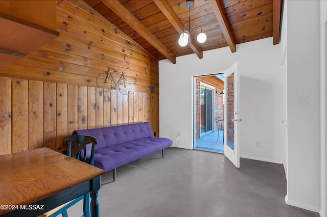 unfurnished room featuring wooden ceiling, vaulted ceiling with beams, a notable chandelier, and wooden walls