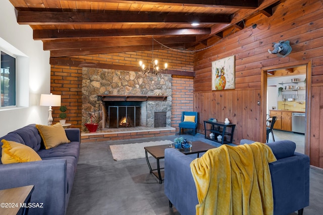 living room featuring wood walls, wooden ceiling, a notable chandelier, a fireplace, and lofted ceiling with beams