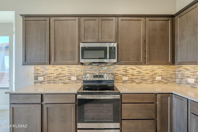 kitchen featuring backsplash and stainless steel appliances