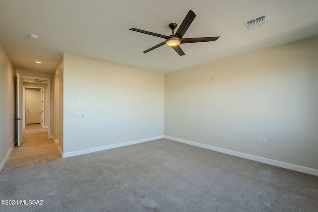 carpeted empty room with ceiling fan