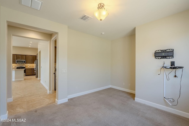 view of carpeted spare room