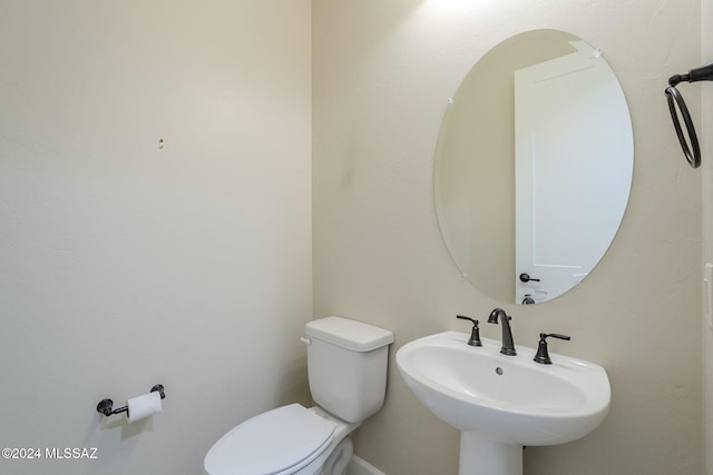 bathroom featuring sink and toilet