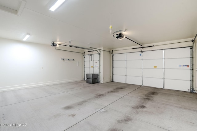 garage featuring a garage door opener