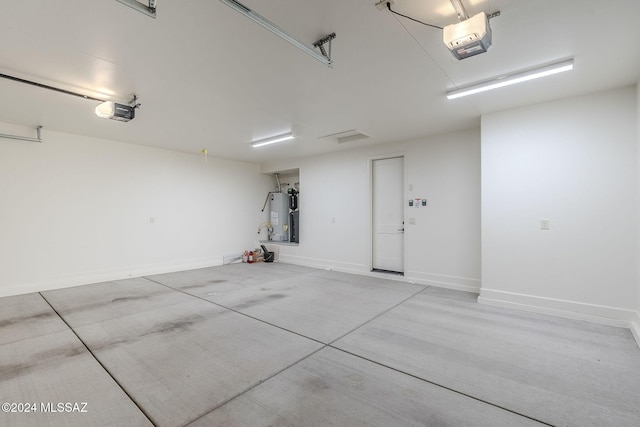 garage featuring a garage door opener and gas water heater