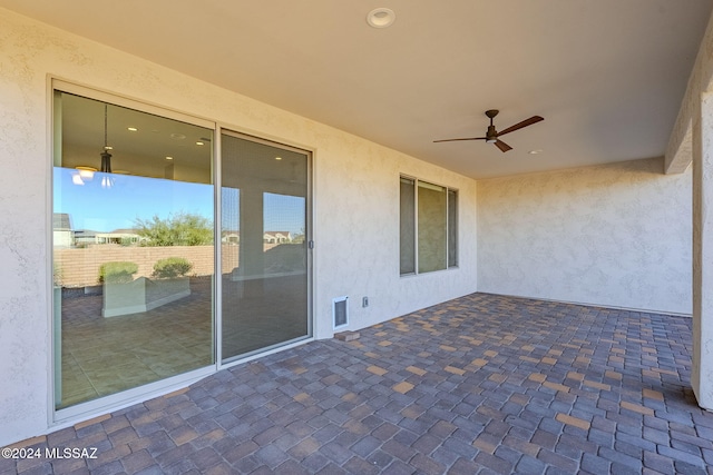 view of patio featuring ceiling fan