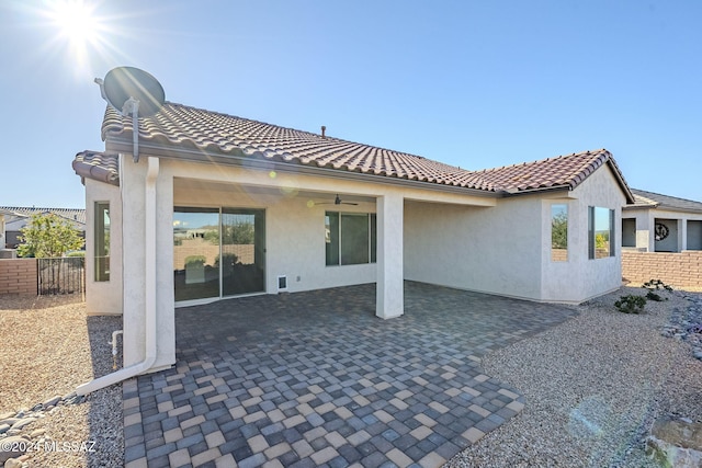 rear view of house featuring a patio