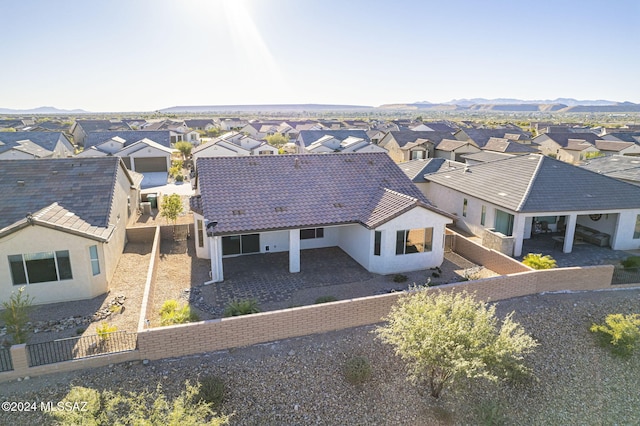 birds eye view of property with a mountain view