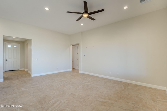 spare room with ceiling fan