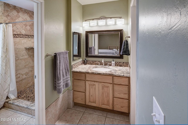 bathroom featuring tile patterned floors, a shower with shower curtain, and vanity