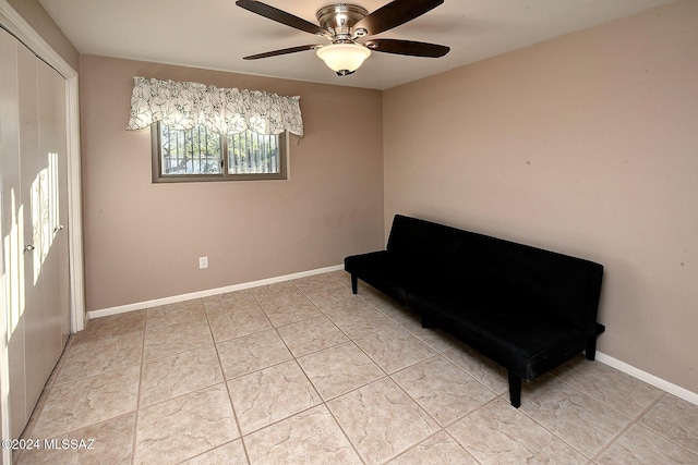 unfurnished room featuring light tile patterned floors and ceiling fan