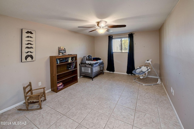 living area with ceiling fan