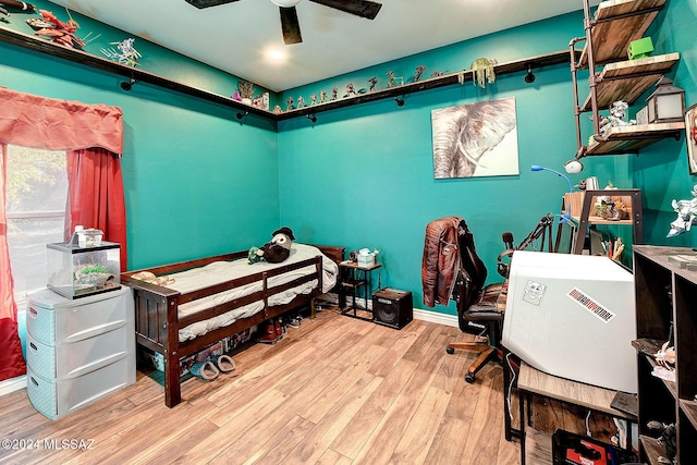 bedroom with light hardwood / wood-style floors