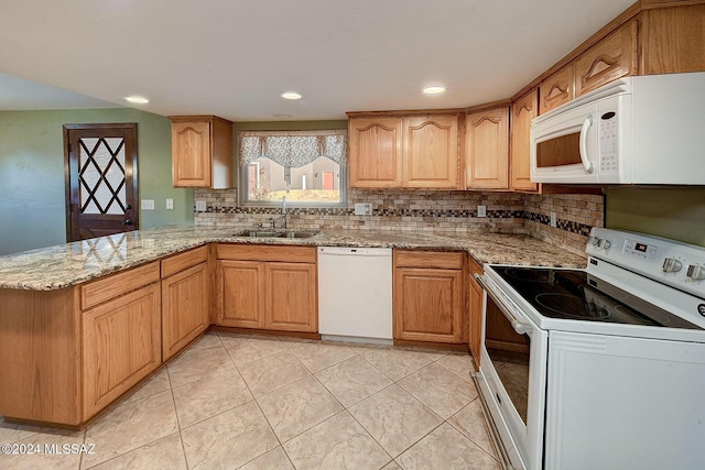 kitchen with sink, tasteful backsplash, kitchen peninsula, white appliances, and light stone countertops