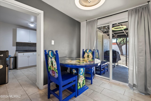 kitchen with stainless steel appliances, white cabinetry, and island exhaust hood