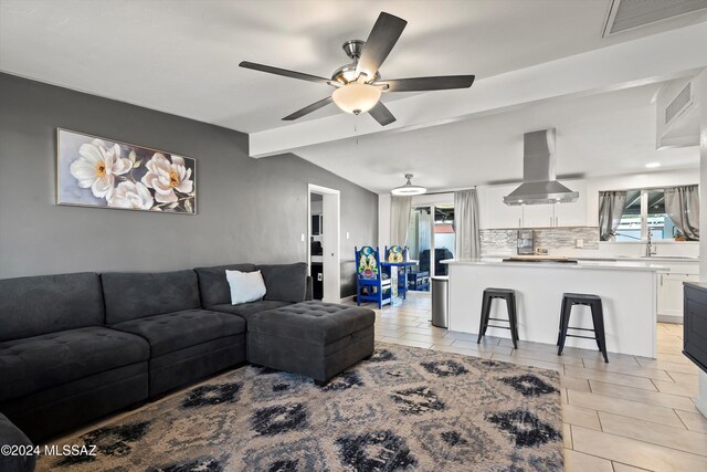 kitchen featuring electric stove, white cabinetry, island exhaust hood, ceiling fan, and light tile patterned flooring