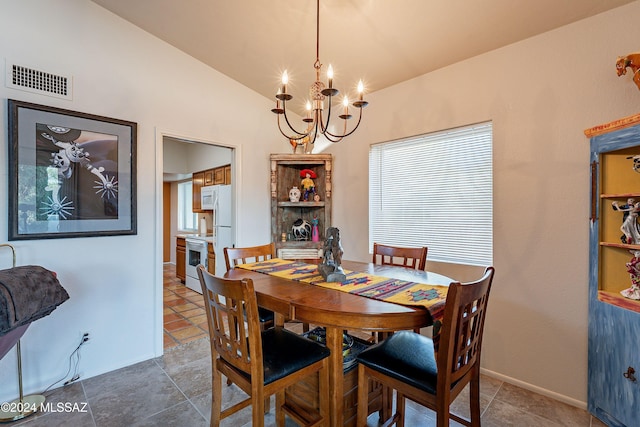 tiled dining space featuring vaulted ceiling and a notable chandelier