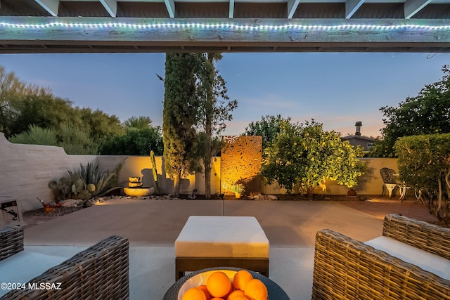 view of patio terrace at dusk