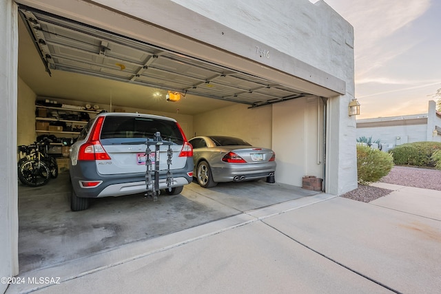 garage at dusk with a garage door opener