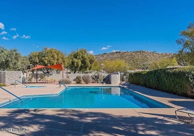 view of swimming pool with a patio