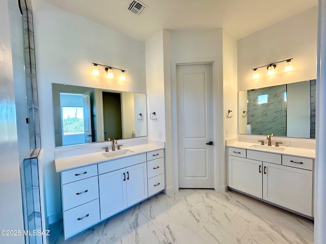 bathroom with two vanities, marble finish floor, a sink, and visible vents